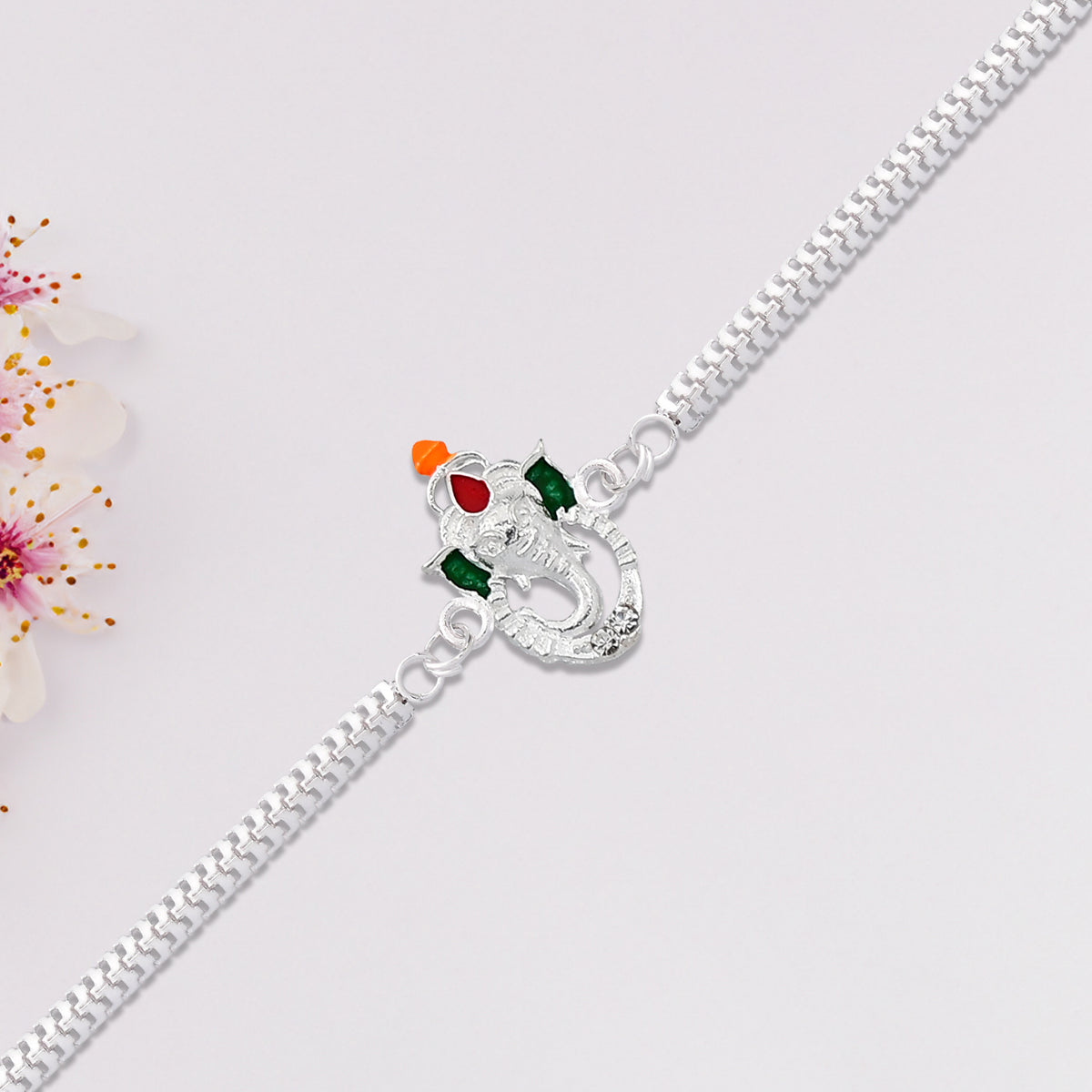 Stylish Ganesha Rakhi With Enamel Highlights And Silver Metal Chain